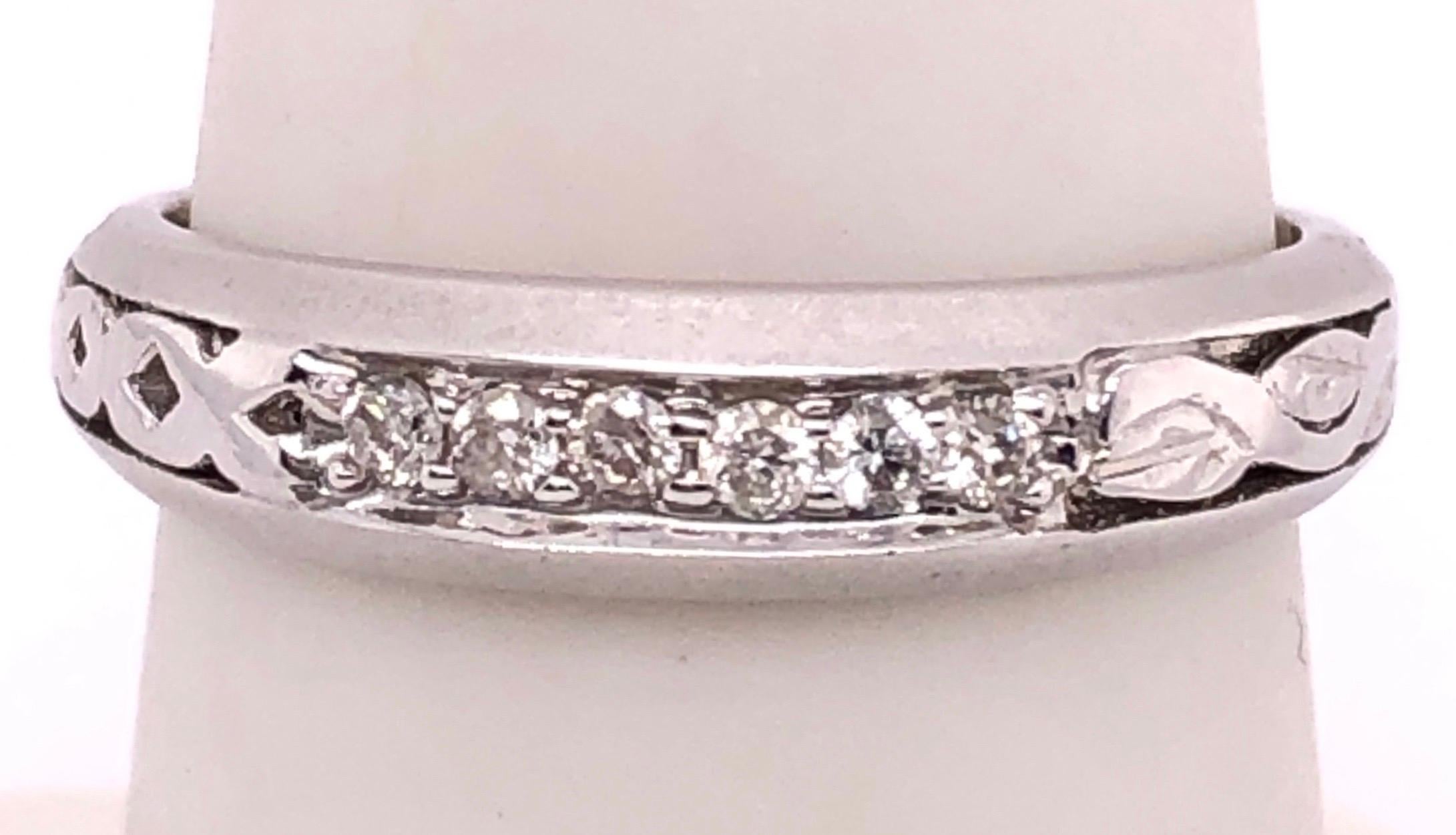 18 Karat White Gold Fashion Ring with Diamonds.
Size 6.5
3.1 grams total weight.