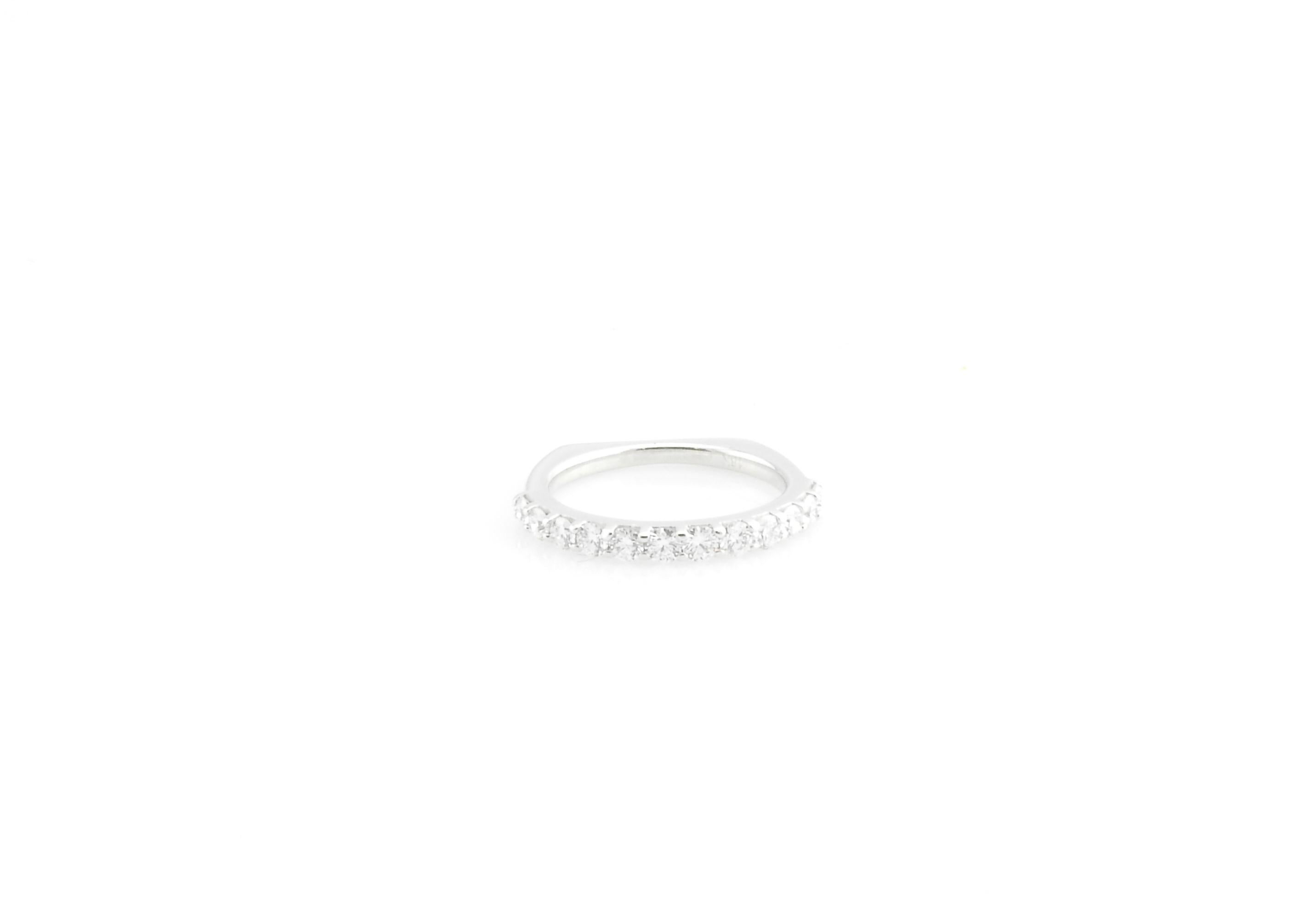 Vintage 14 Karat White Gold and Diamond Wedding Band Size 5.5

This sparkling wedding band features 12 round brilliant cut diamonds set in beautifully detailed 18K yellow gold. Shank: 1.5 mm.

Approximate total diamond weight: .60 ct.

Diamond