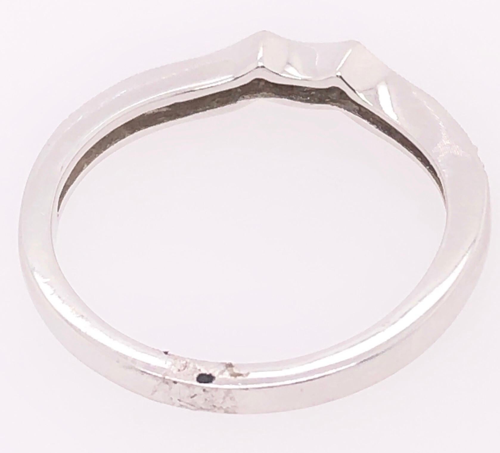 18 Karat White Gold And Diamond Wedding Contour Band Bridal Ring

.0.25 Total Diamond Weight.
Size 6.75
2.47 grams total weight.