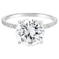 18 Karat White Gold and GIA Certified Round Brilliant Cut Diamond Hidden Halo En