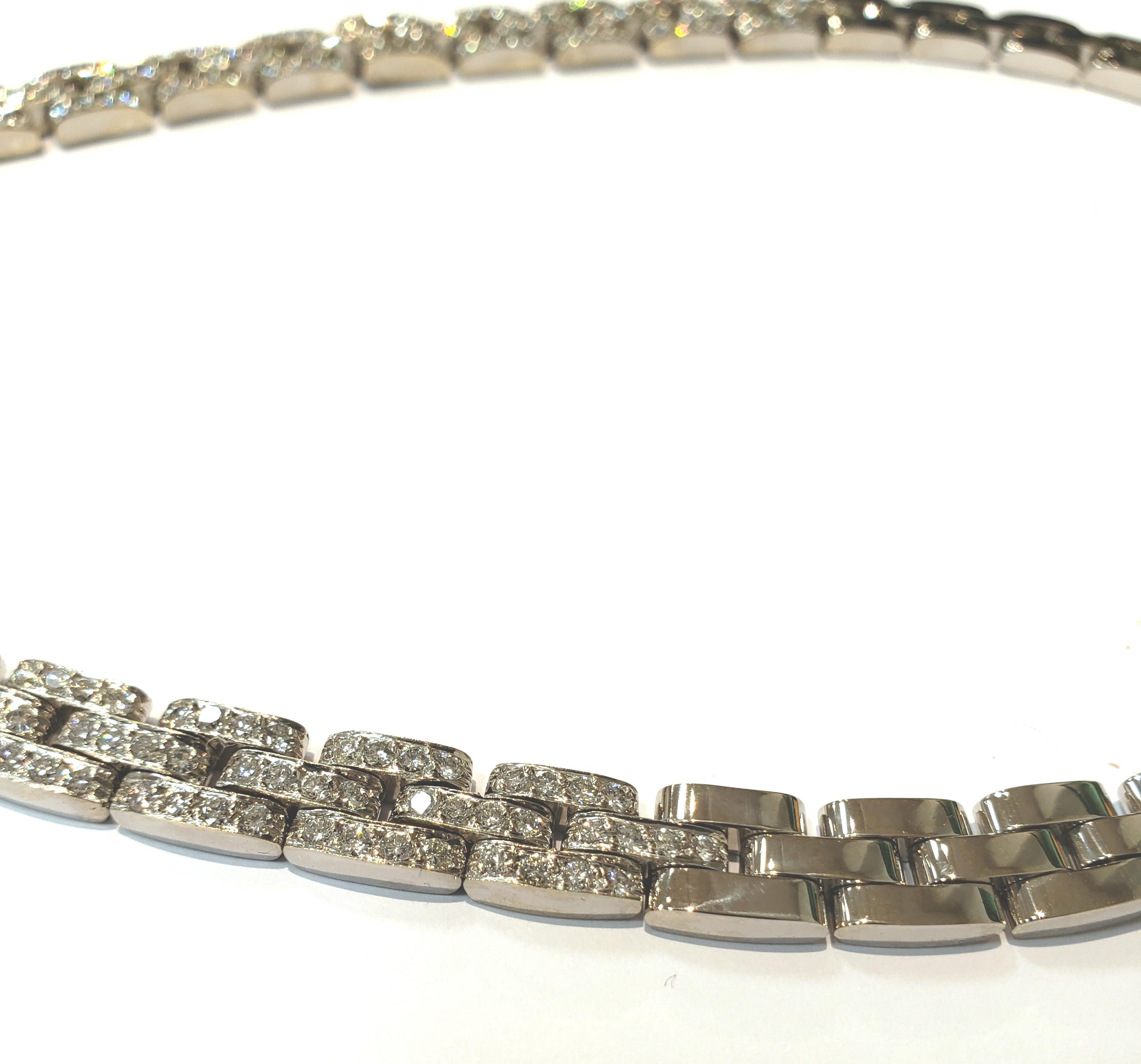 A beautifully made 18 karat white gold interlocking basket weave link, with a pave diamond front. 
Necklace has 20 plain white gold links, & 22 pave diamond links. Diamonds are all full cut stones.
Total diamond weight is 7.20 carats. Necklace is