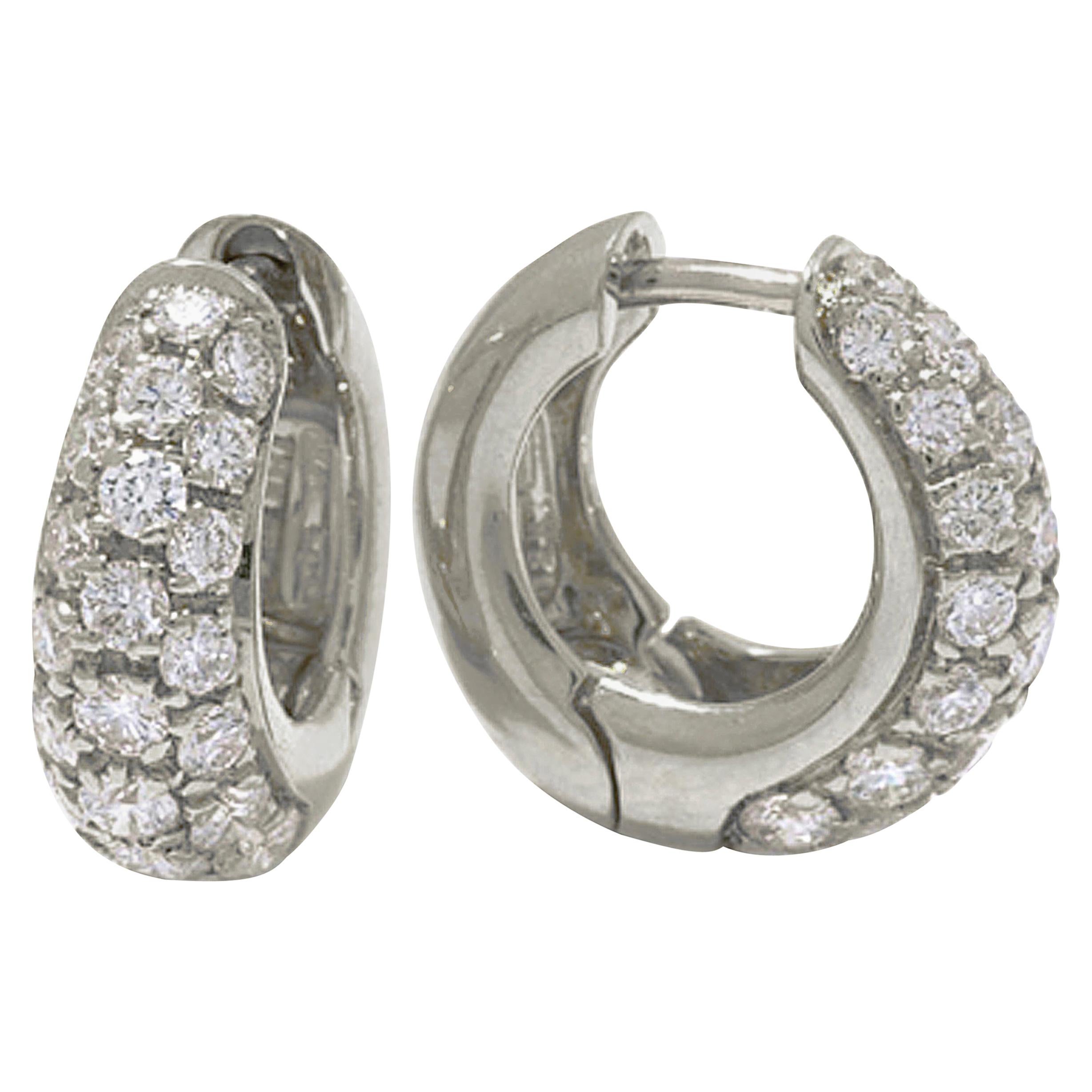 Look your best with these fashionable Pave' Shaped Huggie Earrings!
Crafted from 18-karat gold and set with brilliant white diamonds, these diamond huggies bring a sparkle of elegance and style to your everyday look.
Whether you're on a night out or