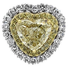 18 Karat White Gold and Platinum 4.65 Carat Yellow Heart Shape Diamond Ring