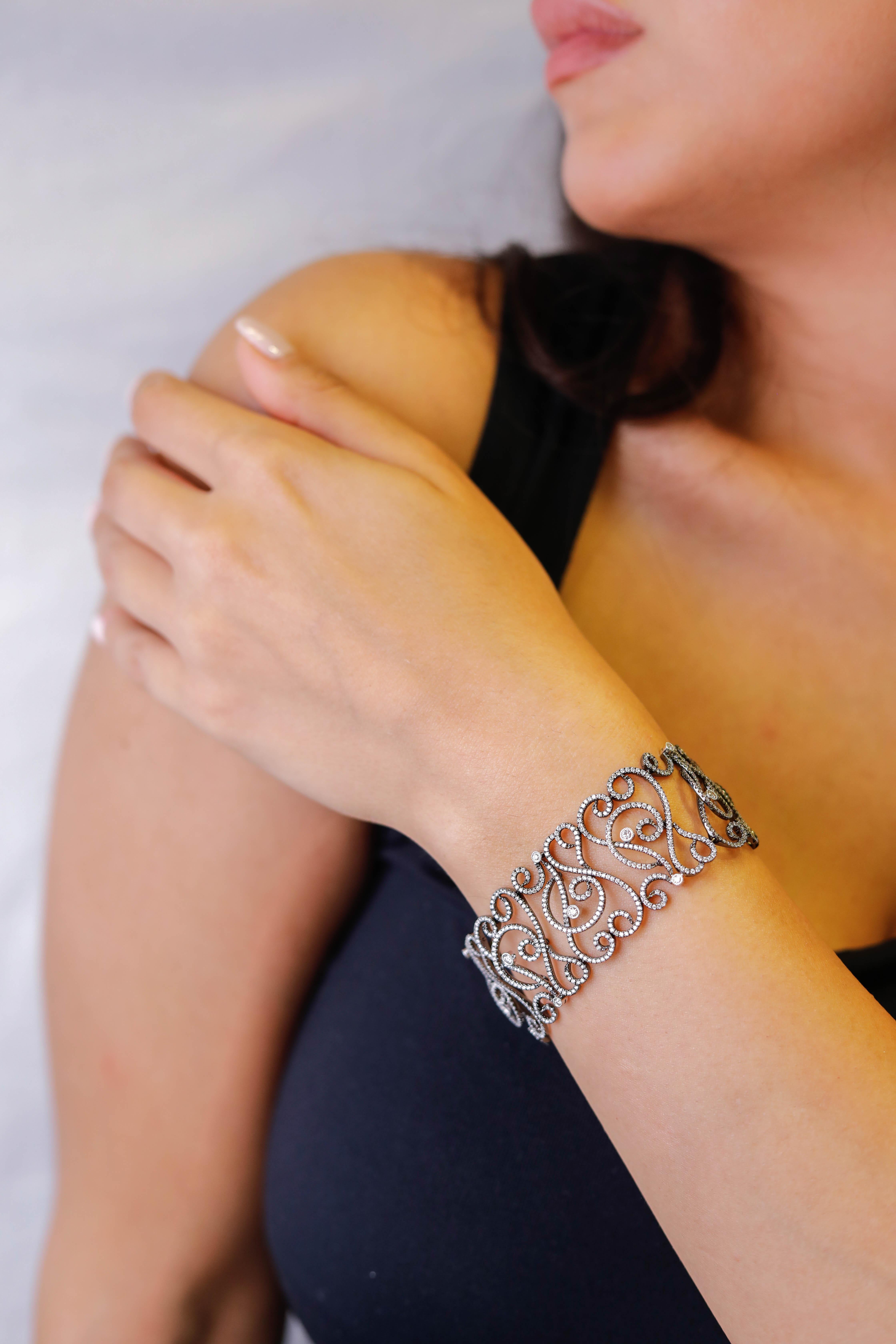 18 Karat White Gold and Platinum Diamond Filigree Bracelet Designer Fine Jewelry

Classic, yet sophisticated design. Crafted in 18k White Gold, this bracelet showcases shimmering diamonds set in a filigree design, creating a dramatic look. Polished