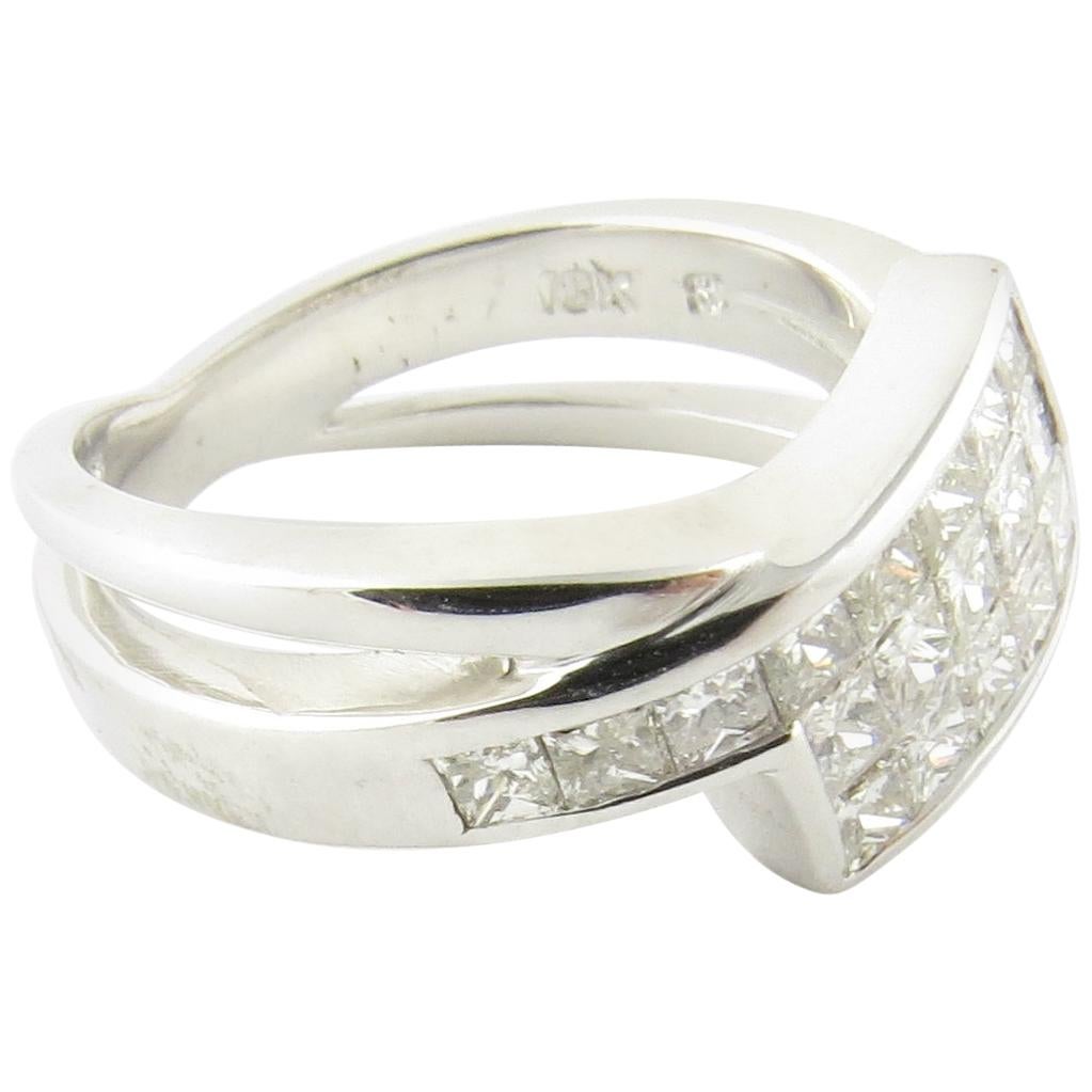 Vintage 18 Karat White Gold and Princess Cut Diamond Ring Size 5.75- 
This sparkling ring features 21 princess cut diamonds set in polished 18K white gold. 
Width: 8 mm. Shank: 3 mm.
 Approximate total diamond weight: 1 ct.
 Diamond color: I-J