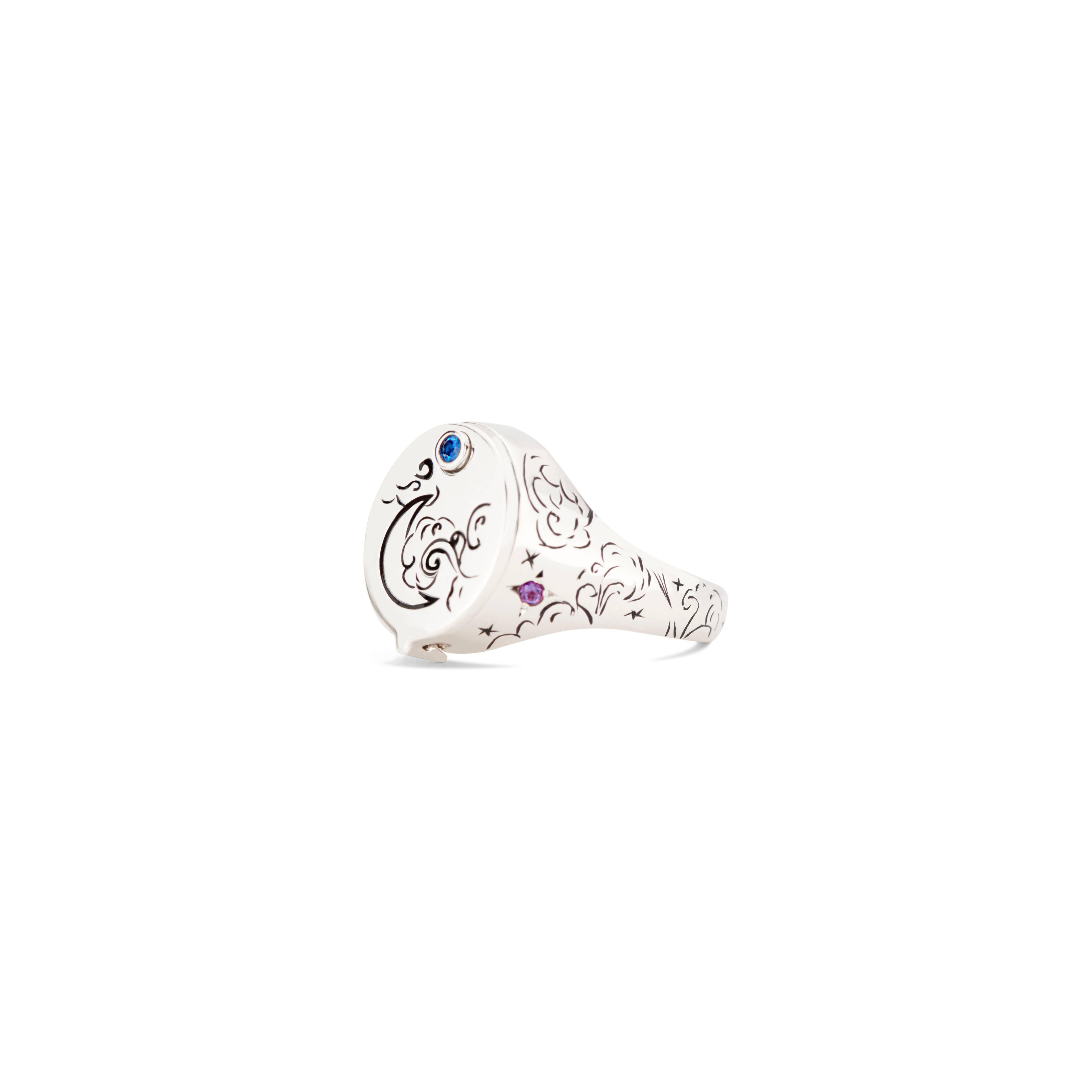 The uniquely sleek 18k white gold and rainbow sapphire Beacon Conservatory Signet features a 