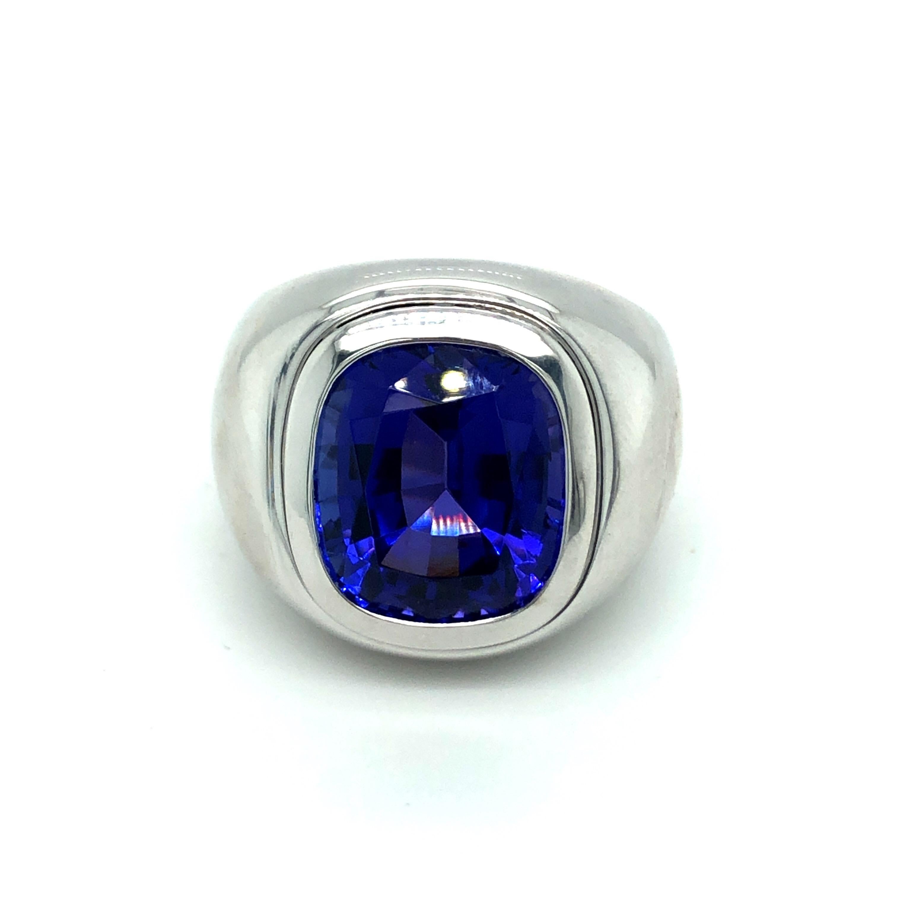 Impressive 18 karat white gold and tanzanite signet ring by the renowned Swiss jeweler Bucherer.
This statement ring features a lively violetish blue tanzanite of impeccable quality weighing 14.7 carats. The bold mounting is crafted in 18 karat