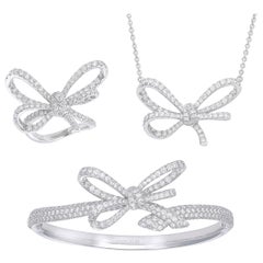 18 Karat White Gold and White Diamonds Bow Bracelet, Pendant and Ring