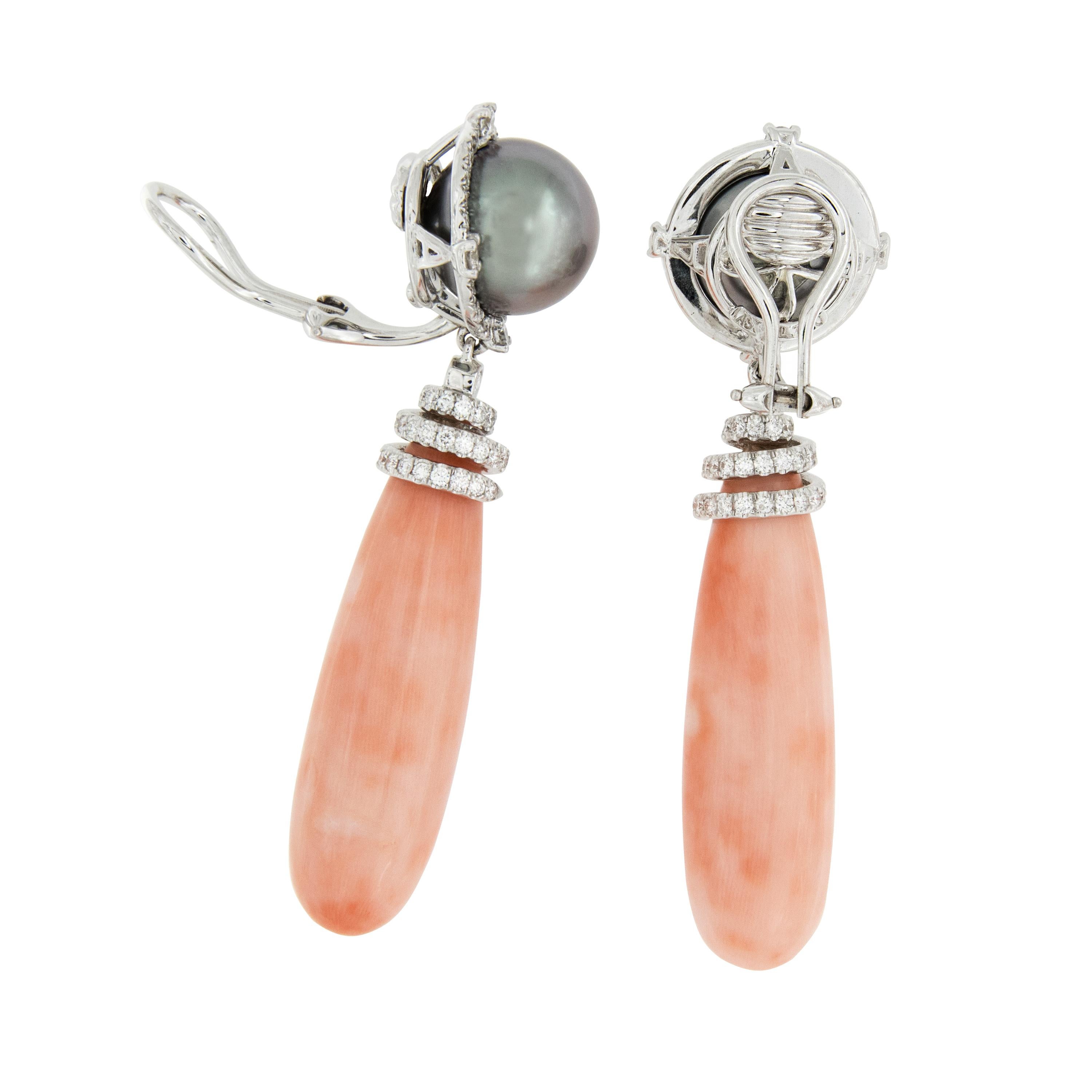 Natural Angel Skin Coral belongs in a rarefied circle of extraordinary gems. This precious coral of Japanese origin is beyond rare and has been virtually unavailable for decades. Now is your time to own something so rare! These lovely earrings have