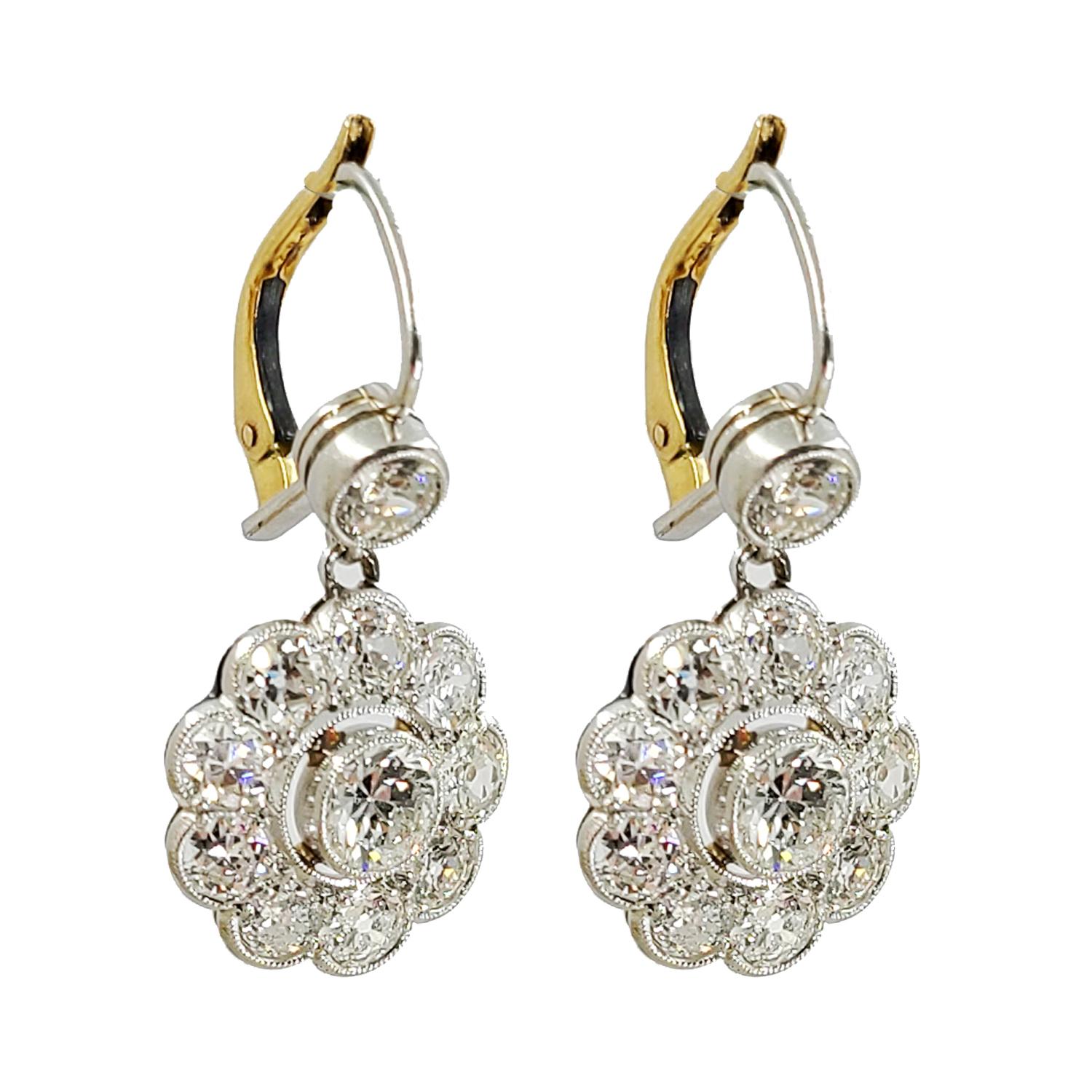 18 Karat White & Yellow Gold Diamond Drop Earrings Featuring 22 Old European Cut Diamonds Of G Color & SI Clarity Totaling Approximately 4.00 Carats In A Floral Design. Hinged Wire Backs. Finished Weight is 5.4 Grams.