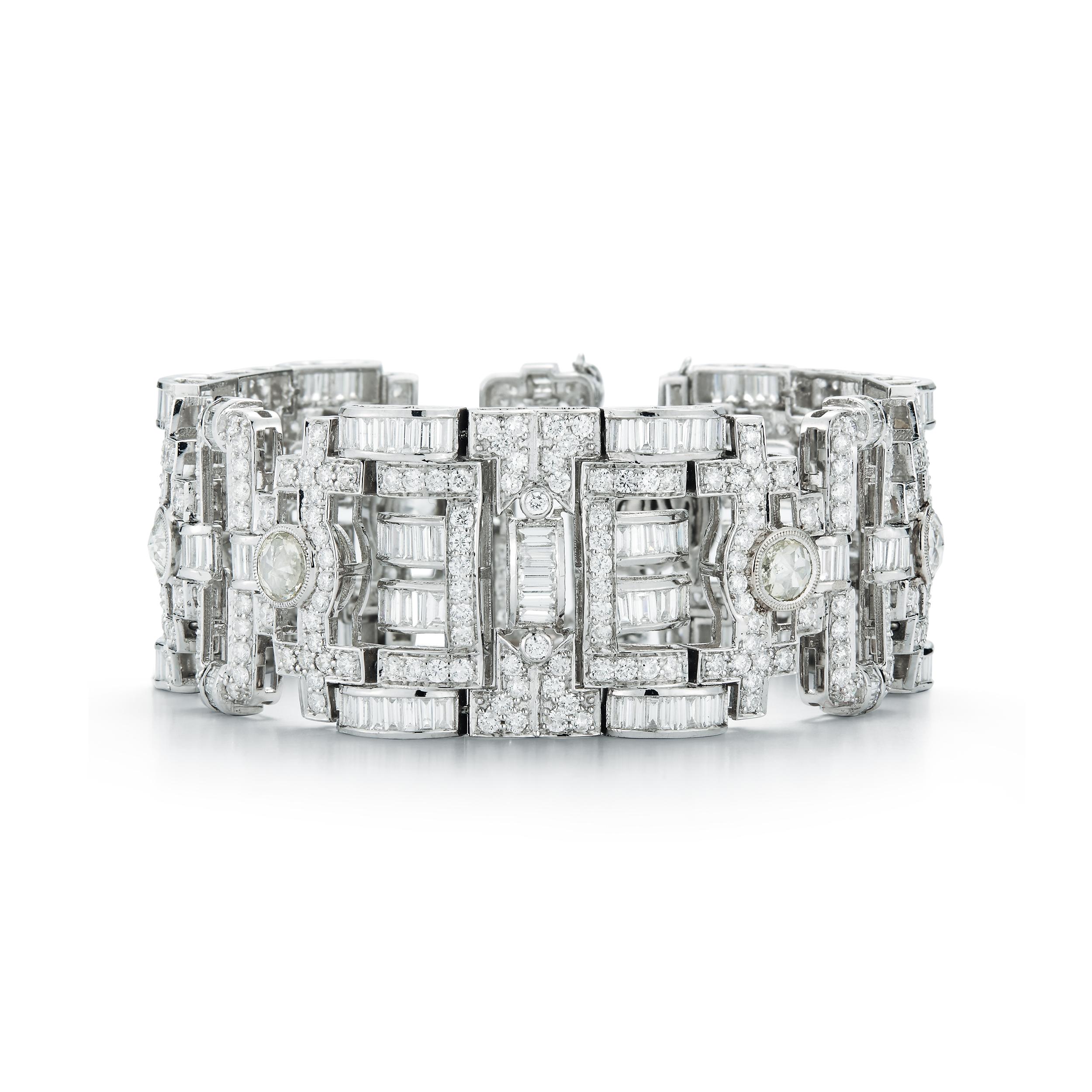 18K white gold Antique style Diamond Bracelet, set with 14.14 carat of round Diamonds, 13.16C. of Baguettes Diamonds and six round Diamonds weight Approx. 6.20C. Total weight of Diamonds 33.50C.
