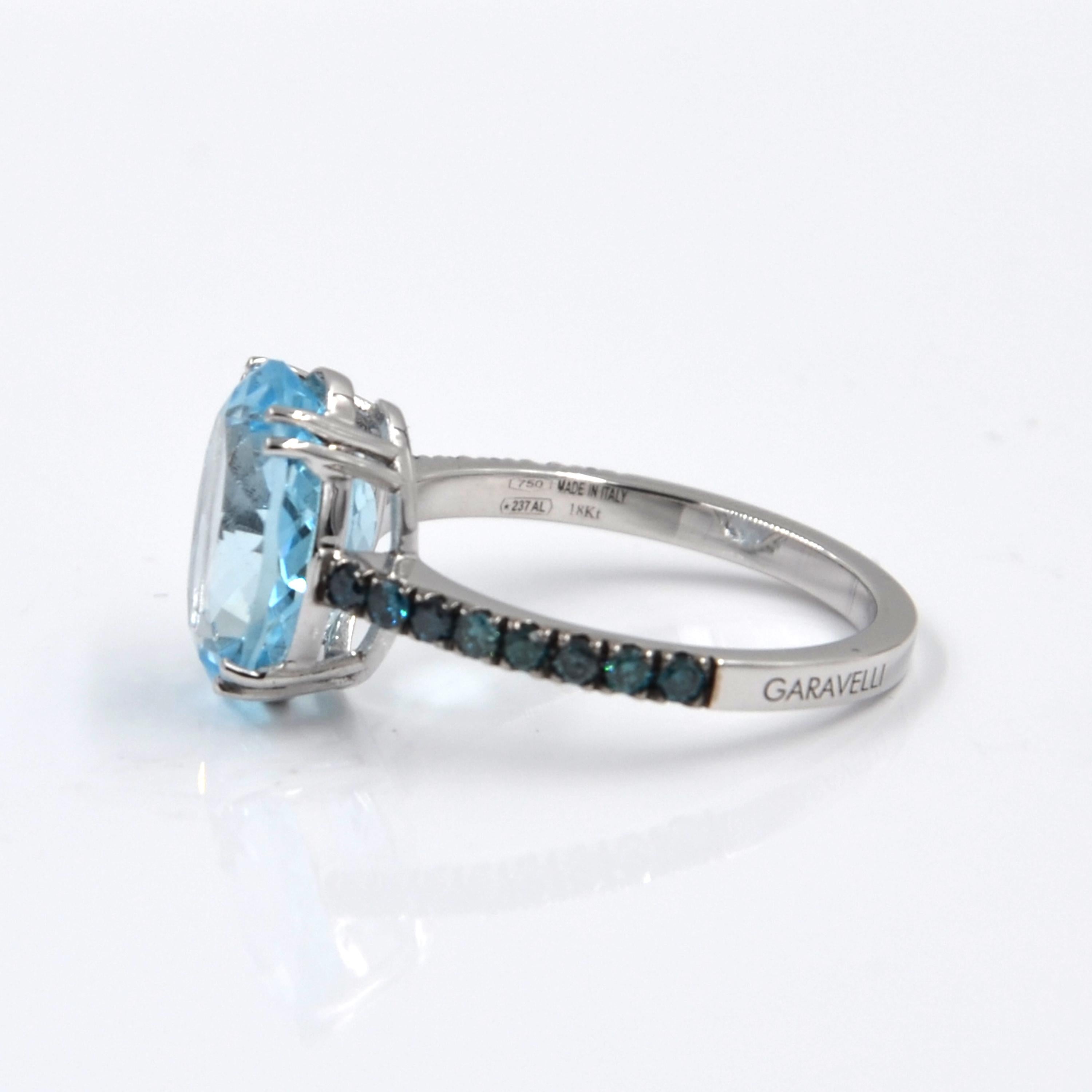 18 Karat White Gold Aquamarine and Blue Diamonds Garavelli Ring
18 kt GOLD  ct: 3,15
Blue DIAMONDS ct : 0,35
OVAL AQUAMARINE ct : 5,79  mm12 X 10
