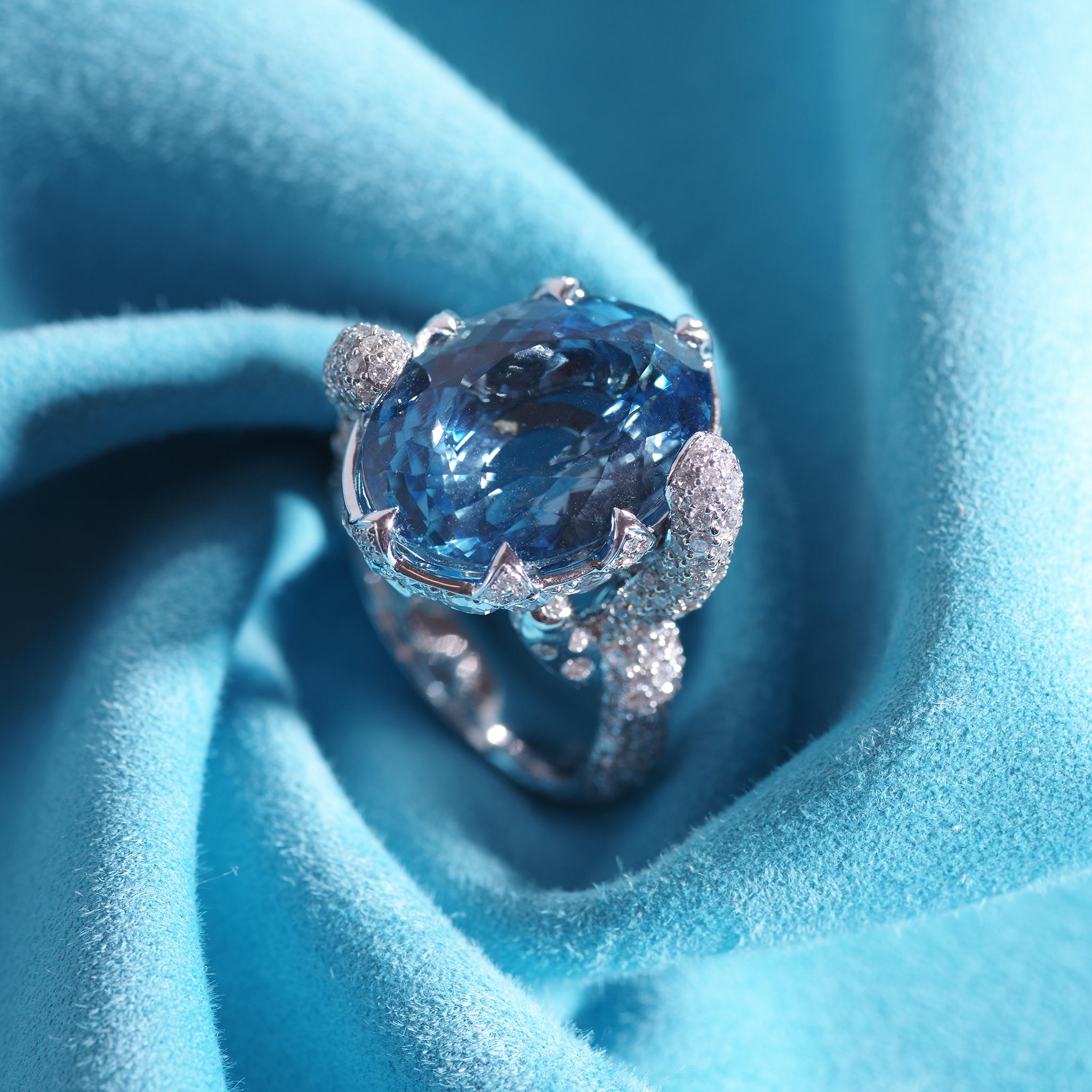 Trinity collection cocktail ring set in 18K white gold with 13.10cts aquamarine and 2.92cts diamond. Ring size 7, can be resized.
