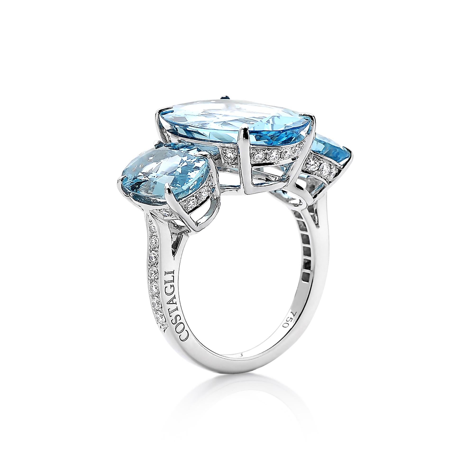 One of a kind oval-shaped aquamarine three stone ring set in 18k white gold with pave-set round, brilliant diamond detailing.

A classic ring silhouette paired with the unique oval cut of the aquamarines makes this jewel truly feel timeless with a