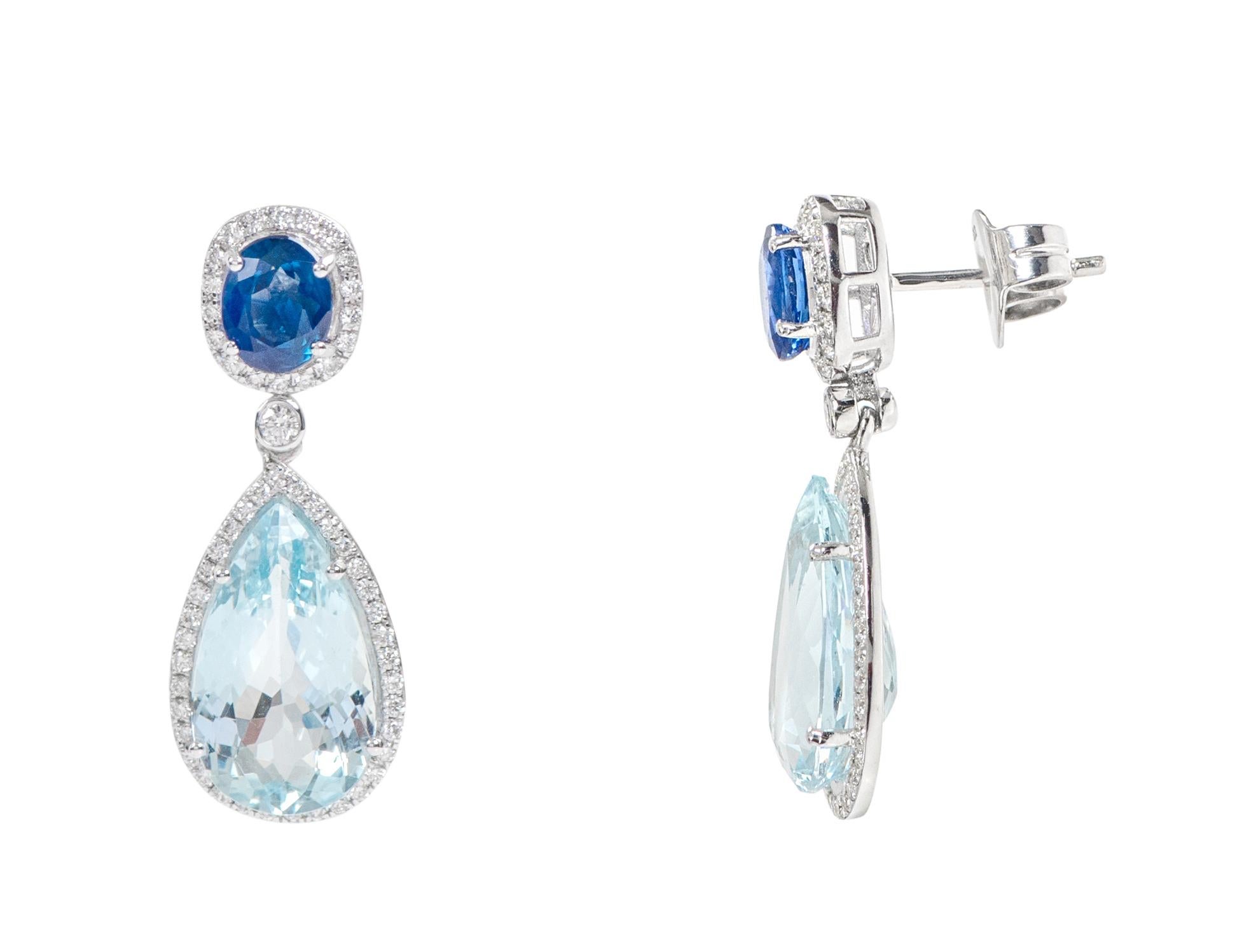 18 Karat White Gold Aquamarine, Blue Sapphire and Diamond Cocktail Drop Earrings

This impressive aqua sky aquamarine, azure blue, and diamond long hanging earring is glorious. The solitaire perfect pear shape aquamarine is surrounded by a single