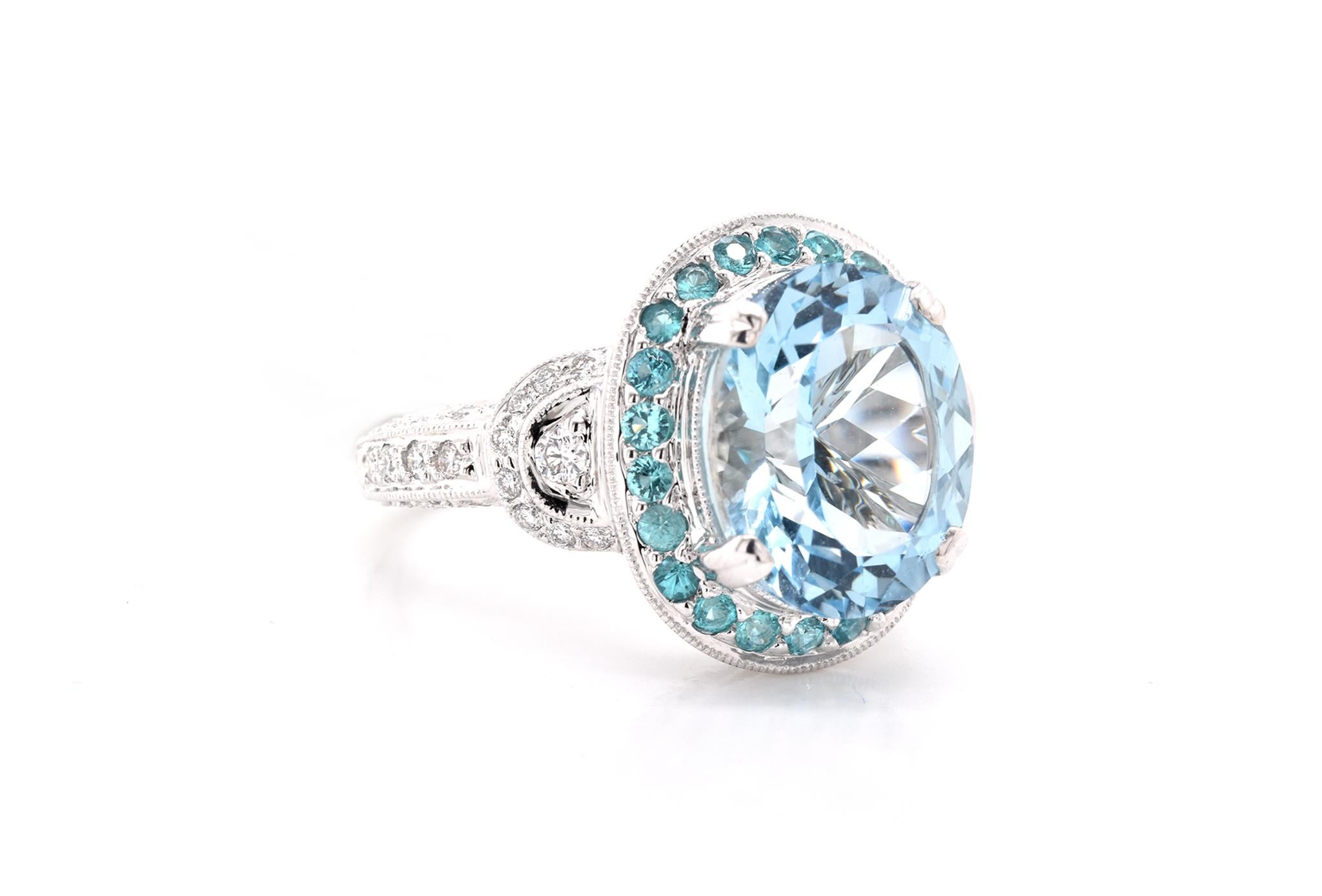 Designer: custom
Material: 18K white gold
Diamonds: 42 round brilliant cut = .38cttw 
Color: G
Clarity: VS
Aquamarine: 1 oval cut = 4.60ct
Paraiba Tourmaline: 22 round cut = .36cttw
Ring Size: 6.5 (please allow up to 2 additional business days for