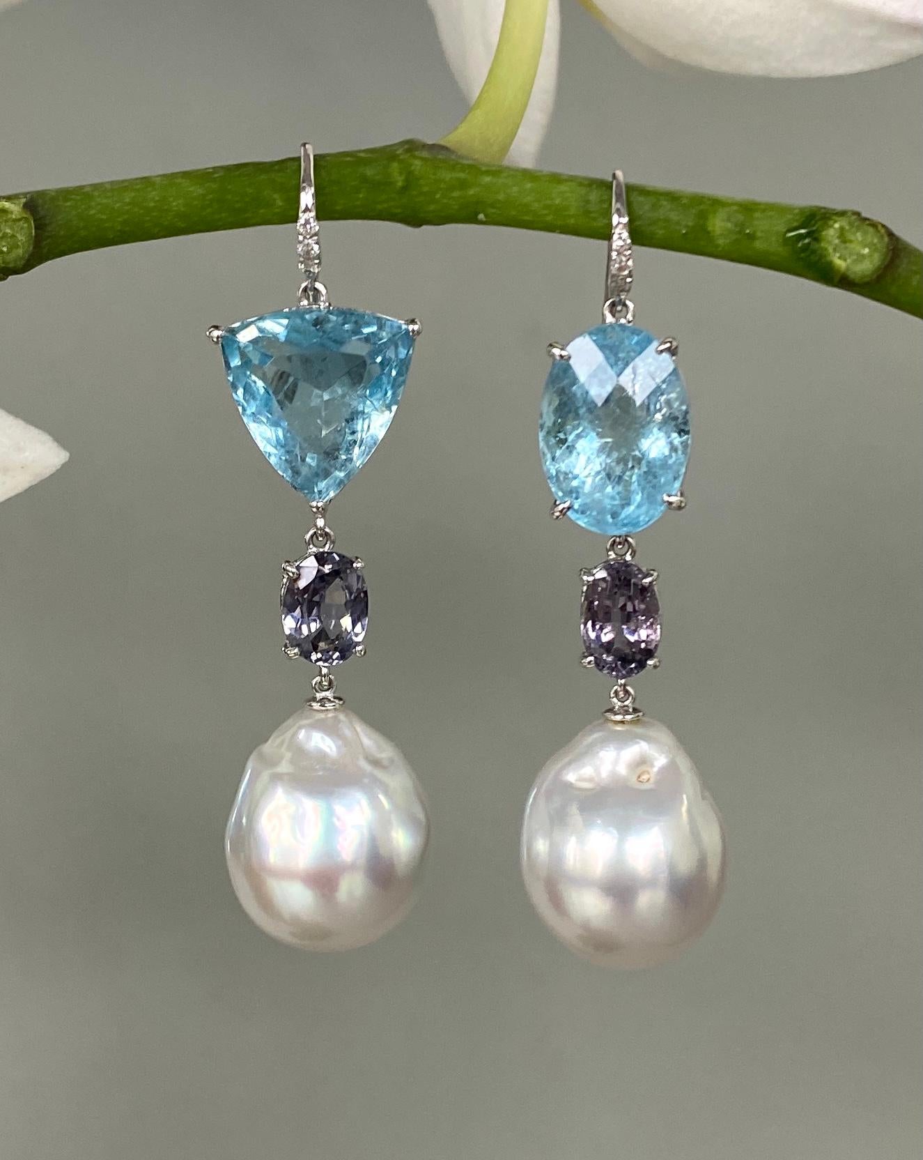 Beautiful one-of-a-kind drop dangle earrings of aquamarines, purple sapphires and white baroque South Sea pearls, handcrafted in 18 karat white gold.

These gorgeous drop dangle earrings of perfectly 