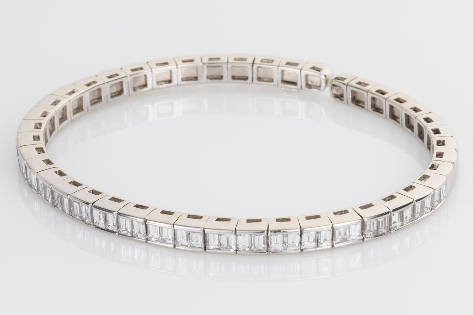 This bangle is super cool! So wearable, not too over the top but enough sparkle on your wrist to catch attention. This Italian crafted flexible cuff is set with 46 bright white baguette cut diamonds running all the way around the front of the