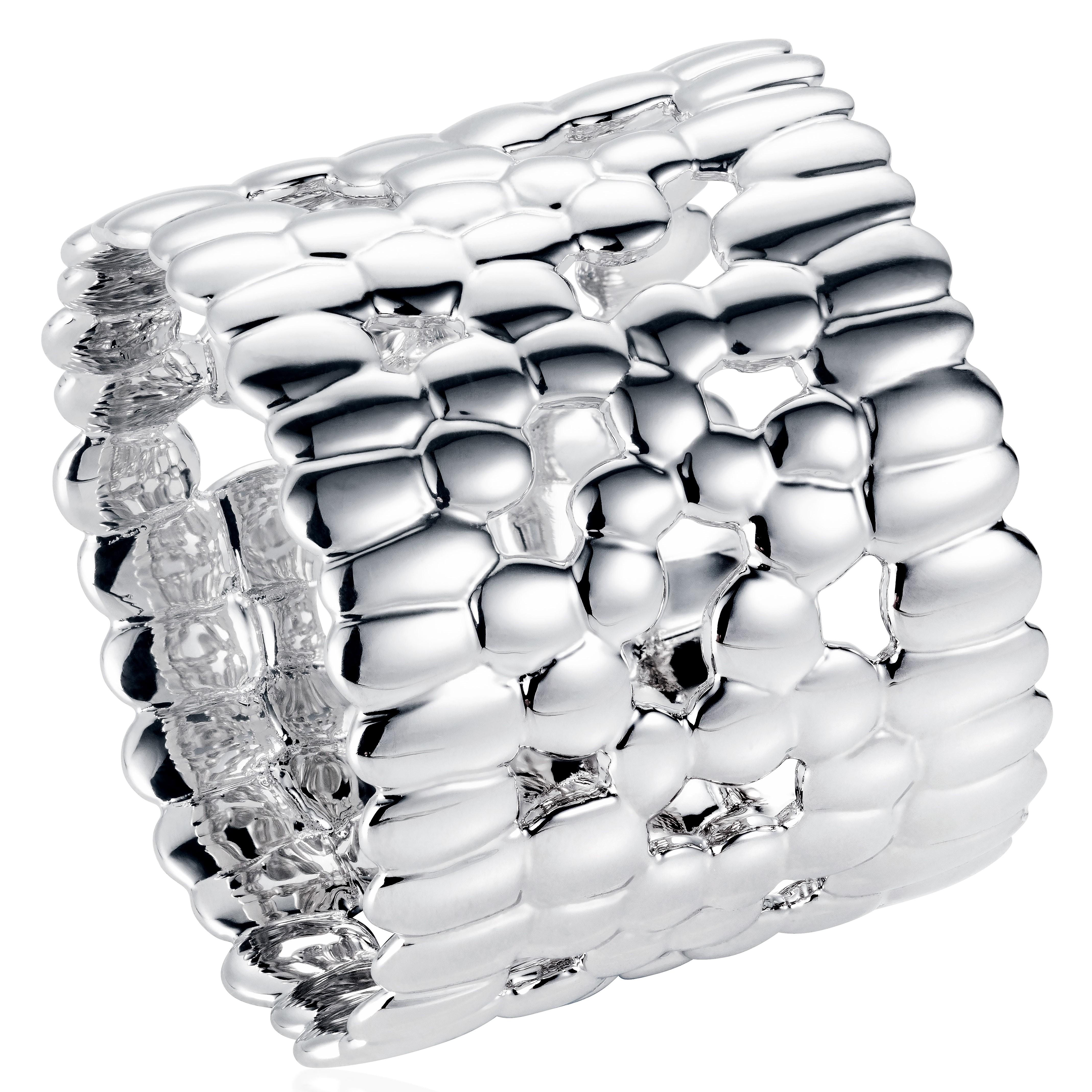 18 Karat White Gold Band Ring

This unisex ring puts a unique spin on the classic white gold ring. It is part of the Skin collection, which is inspired by the designer's mixed heritage. This collection celebrates differences, unifies cultures and