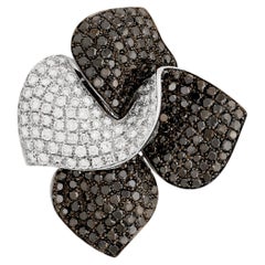 18 Karat White Gold Black and White Diamond Flower Swirl Pin