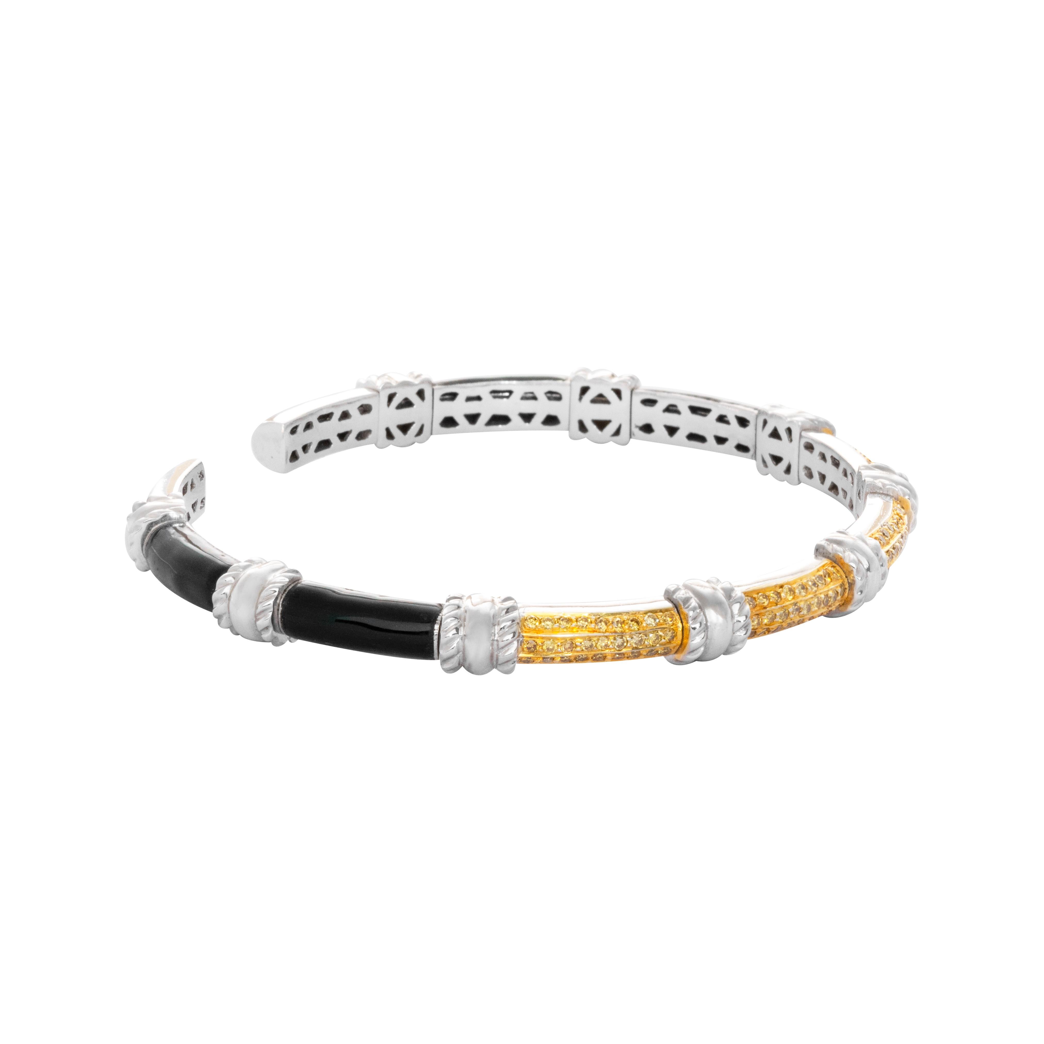 18 Karat White Gold Black Enamel Yellow Diamond Cuff Bracelet

This unique, light weight cuff bracelet set in 18 karat white gold studded with yellow diamonds and black enamel is perfect for a cocktail party or for evening wear.

Diamonds -