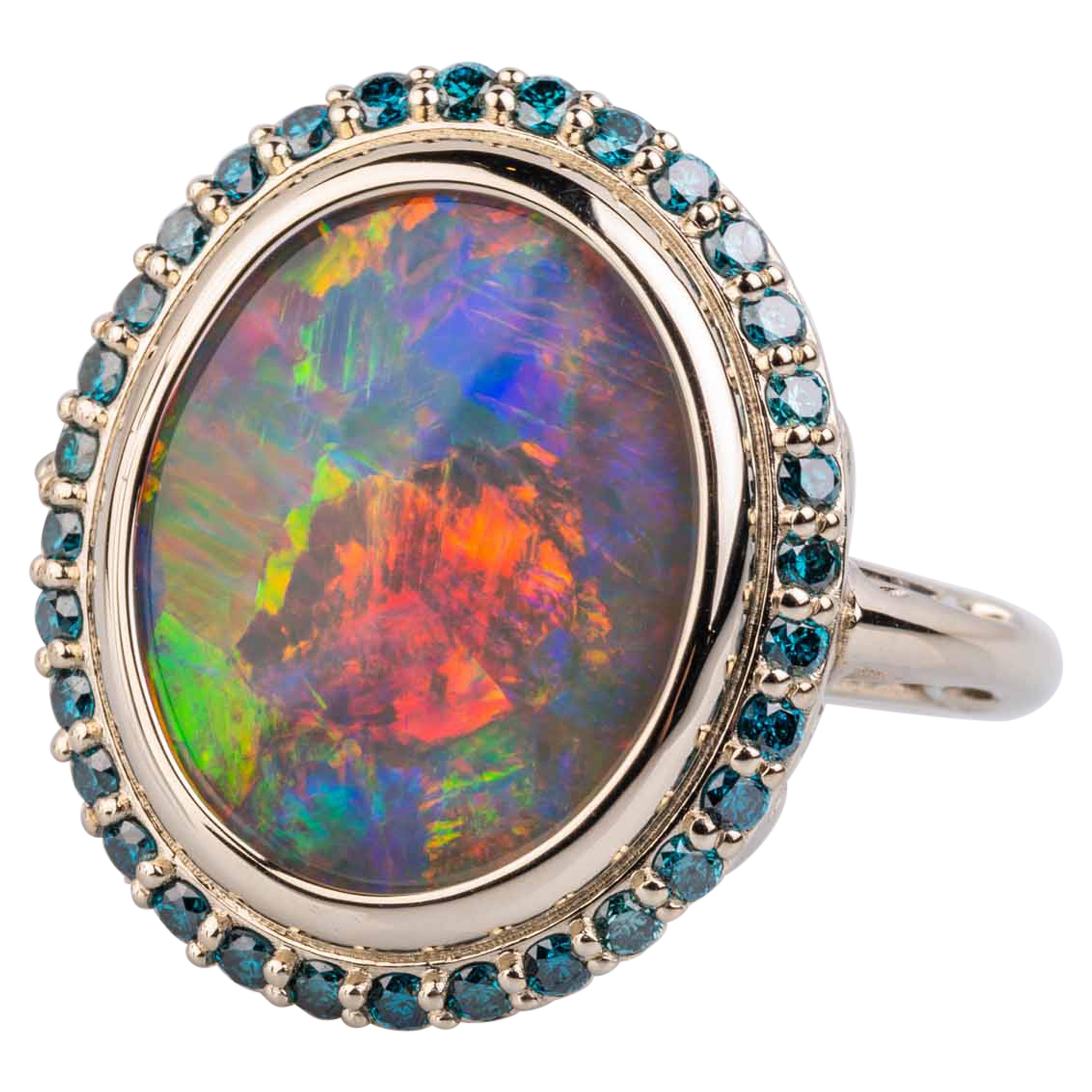 18 Karat White Gold Black Opal Ring with Teal Blue Diamond Halo