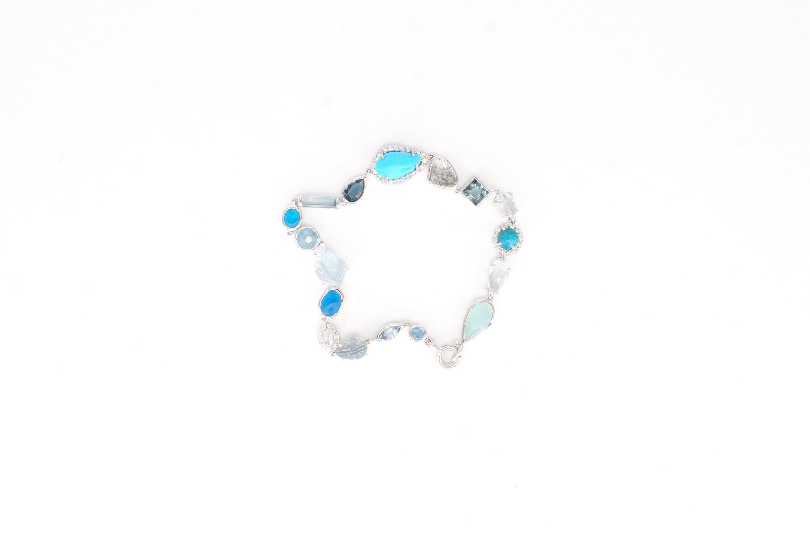 Baby Bracelet
A blue hued gemstone and diamond bracelet, entirely flexible and set in eighteen-karat white gold.
Approximately 7 inches long
17 stones
Diamond Total Weight – 0.385ct.
Gemstone Total Weight – 11.64 cts.
This piece, in its entirety,