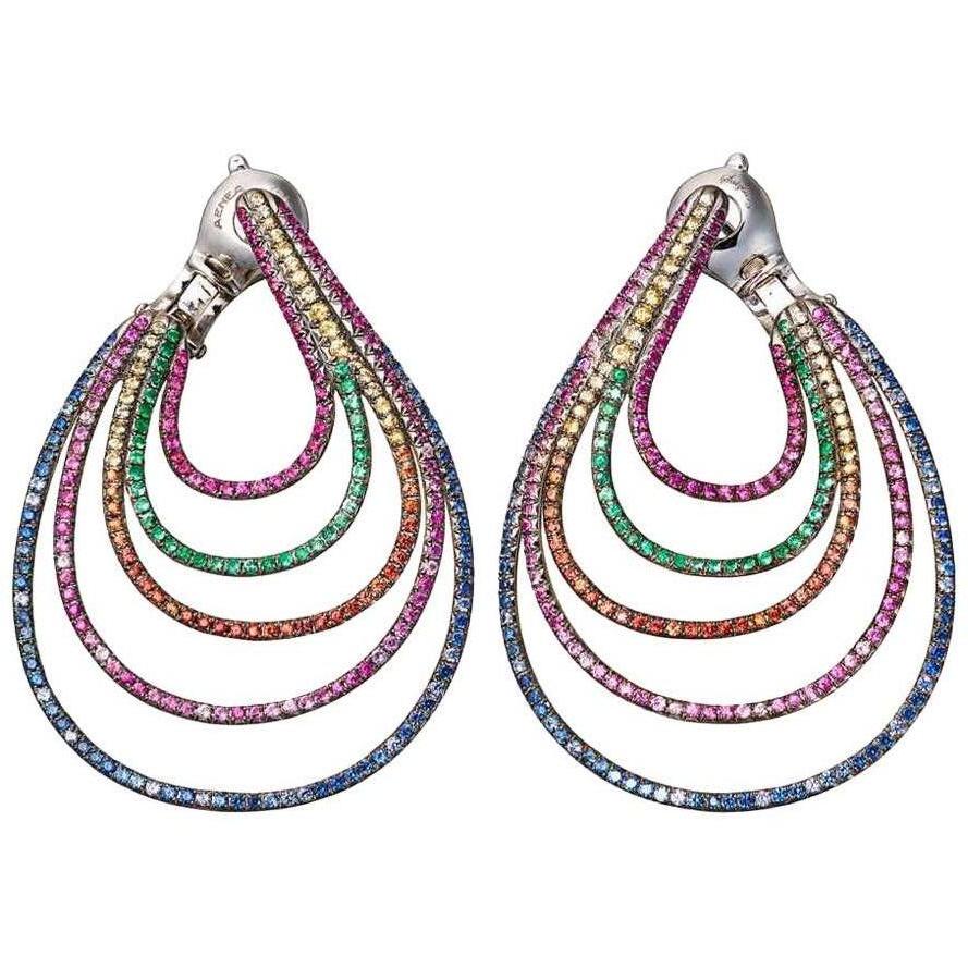 Earrings handcrafted in White Gold with multicoloured Gemstones 

Paving: multicoloured Gemstones; White Diamonds; Emeralds; Blue Sapphires; Rubies; Pink Sapphires; Yellow Sapphires 
Material: White Gold 750

We also offer matching rings and