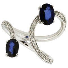 18 Karat White Gold Blue Sapphire and Diamond Bypass Fashion Ring