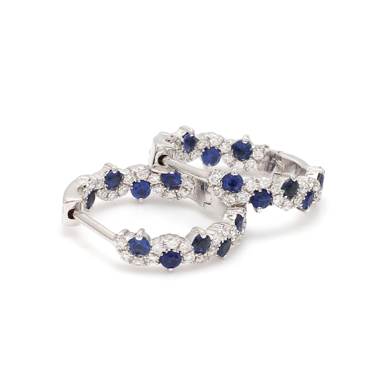 A Beautiful Handcrafted Hoop Earring in 18 karat White Gold with Natural Brilliant Cut Colorless Diamond And Natural Blue Sapphire. A Statement piece for Evening Wear

Natural Diamond Details
Pieces : 68 Pieces
Weight : 0.47 Carat 
Clarity of