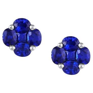 18 Karat White Gold Blue Sapphire Flower Studs For Sale