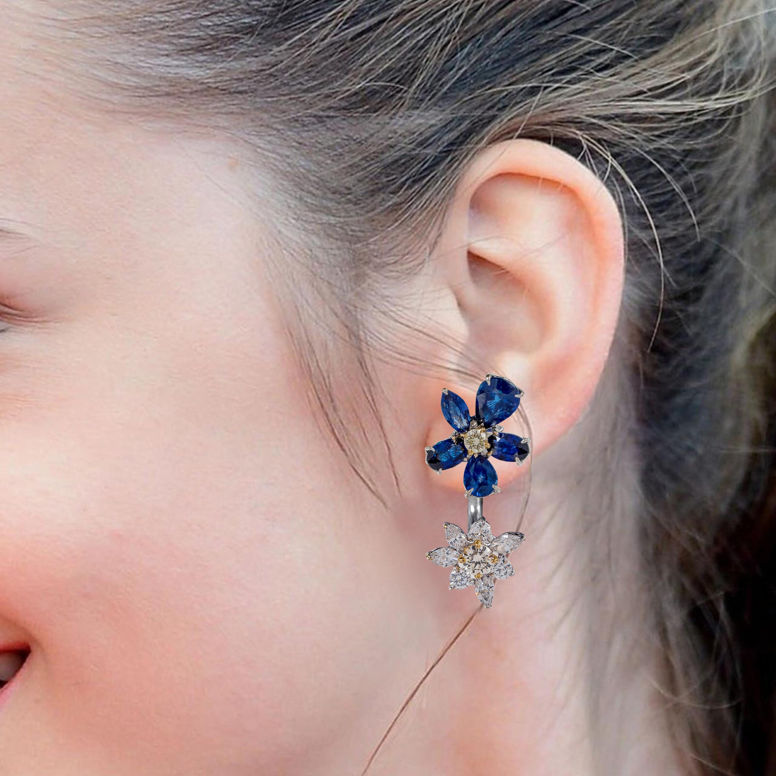 18 Karat White Gold Blue Sapphire, White, and Yellow Diamond Stud Earrings

This impressive double-floral midnight blue sapphire and diamond earring pair is graphically pleasing. The mix of shape and cuts of vivid blue sapphires form the petals of