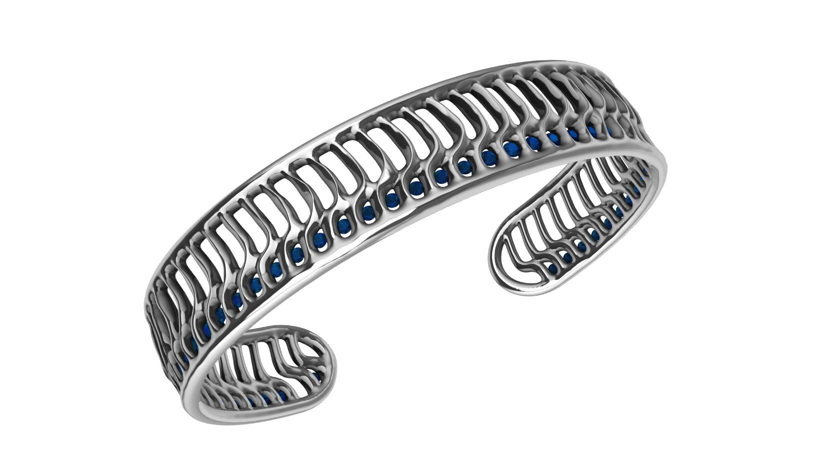 Taille ronde Bracelet manchette vague ouverte en or blanc 18 carats et saphirs bleus en vente