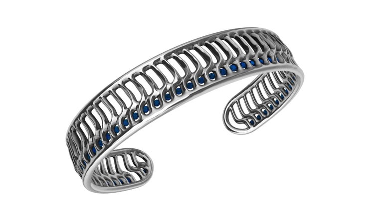 Round Cut 18 Karat White Gold Blue Sapphires Open Wave Cuff Bracelet For Sale
