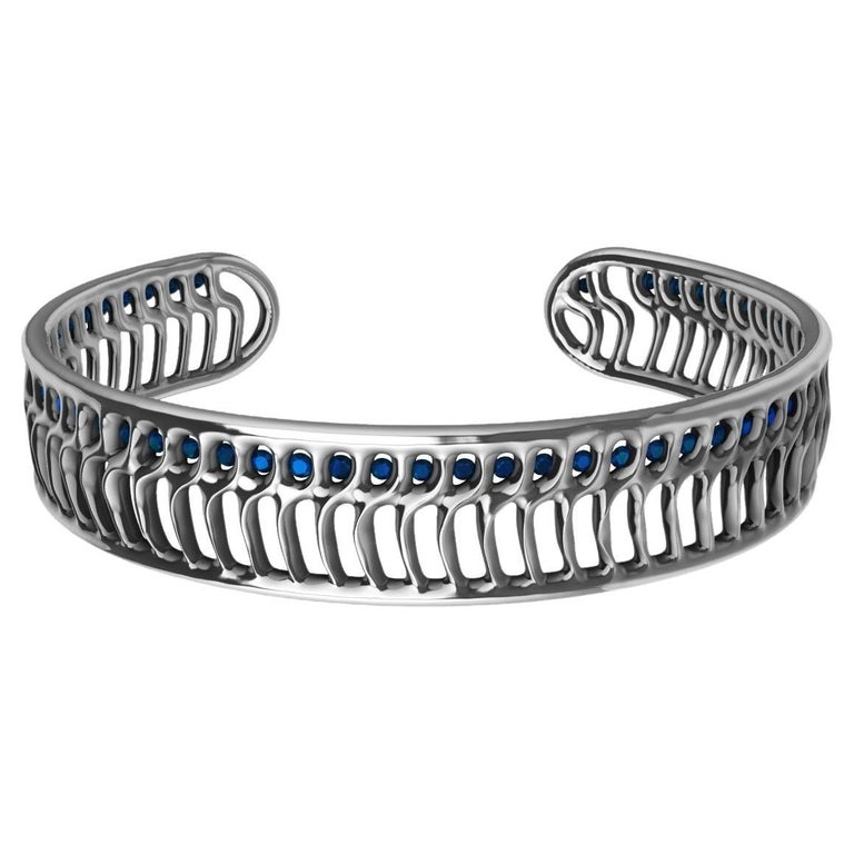 18 Karat White Gold Blue Sapphires Open Wave Cuff Bracelet For Sale