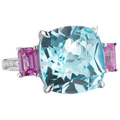 18 Karat White Gold Blue Topaz, 12.10 Carat and Pink Sapphire, 1.20 Carat Ring