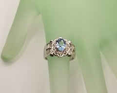 18 Karat White Gold Blue Topaz and Diamond Baguette Ring