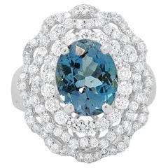 18 Karat White Gold Blue Topaz and Diamond Ballerina Ring