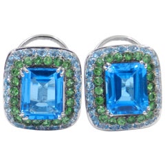 Pendientes Garavelli de oro blanco de 18 quilates, topacio azul y tzavorita
