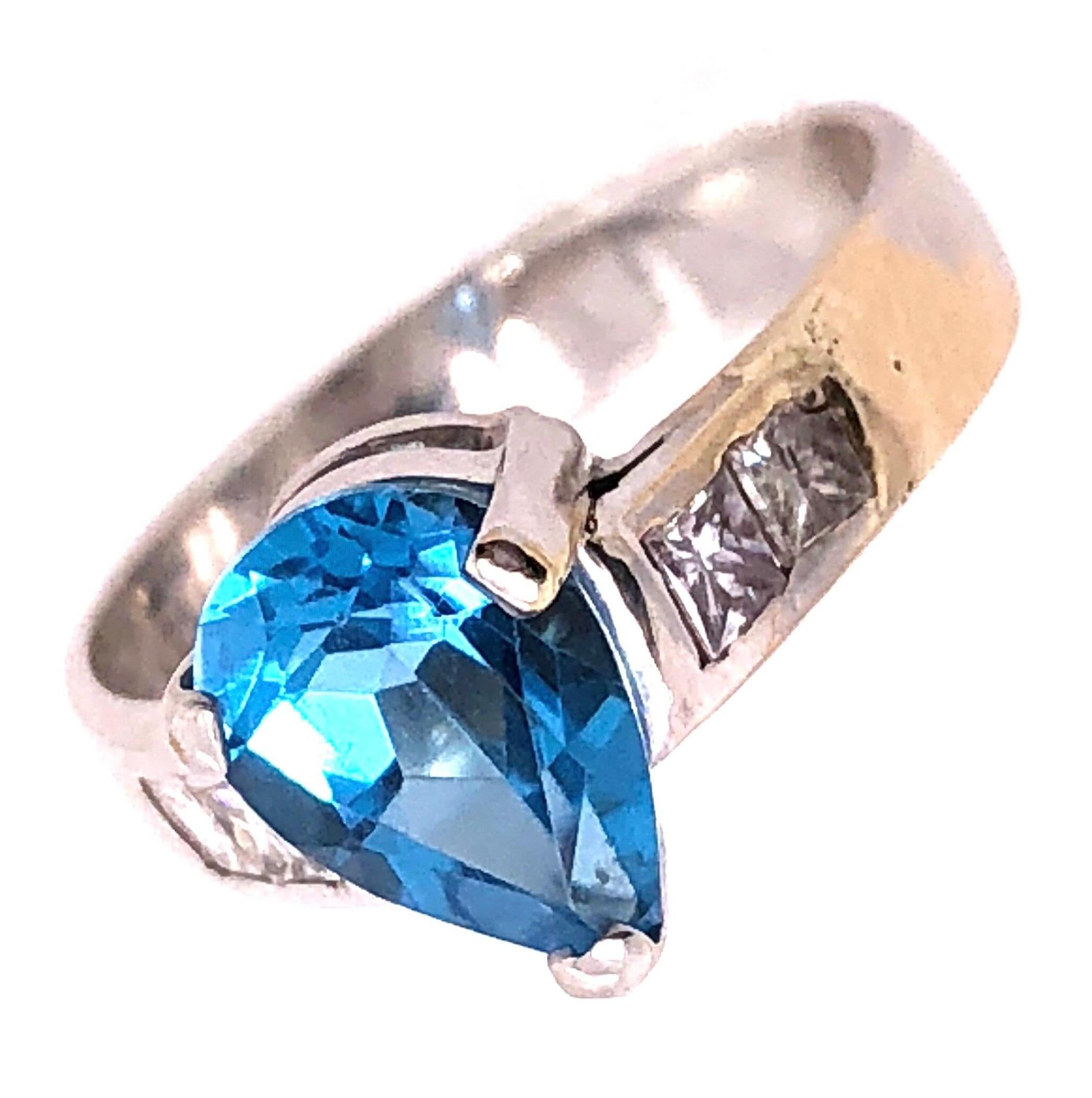 Women's or Men's 18 Karat White Gold Blue Topaz Center with Diamond Accents Ring 0.72 TDW For Sale