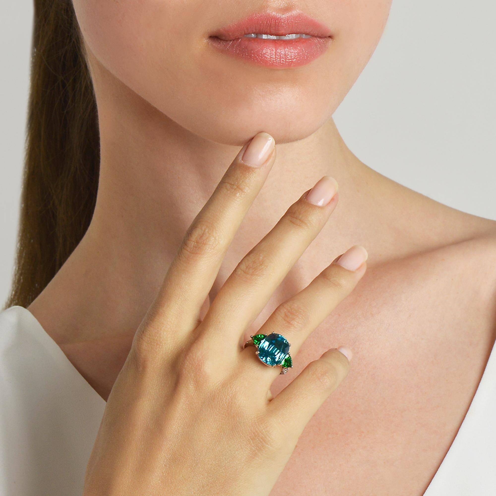 18 karat white gold three-stone ring set with an oval blue zircon flanked by two trillion-cut green tourmalines with diamond detail. 

Each Paolo Costagli contemporary engagement ring is a one of a kind, handcrafted testament to your love story.