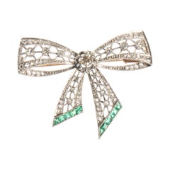 18 Karat White Gold Bow Brooch with Round Diamonds and Square Cut Emeralds