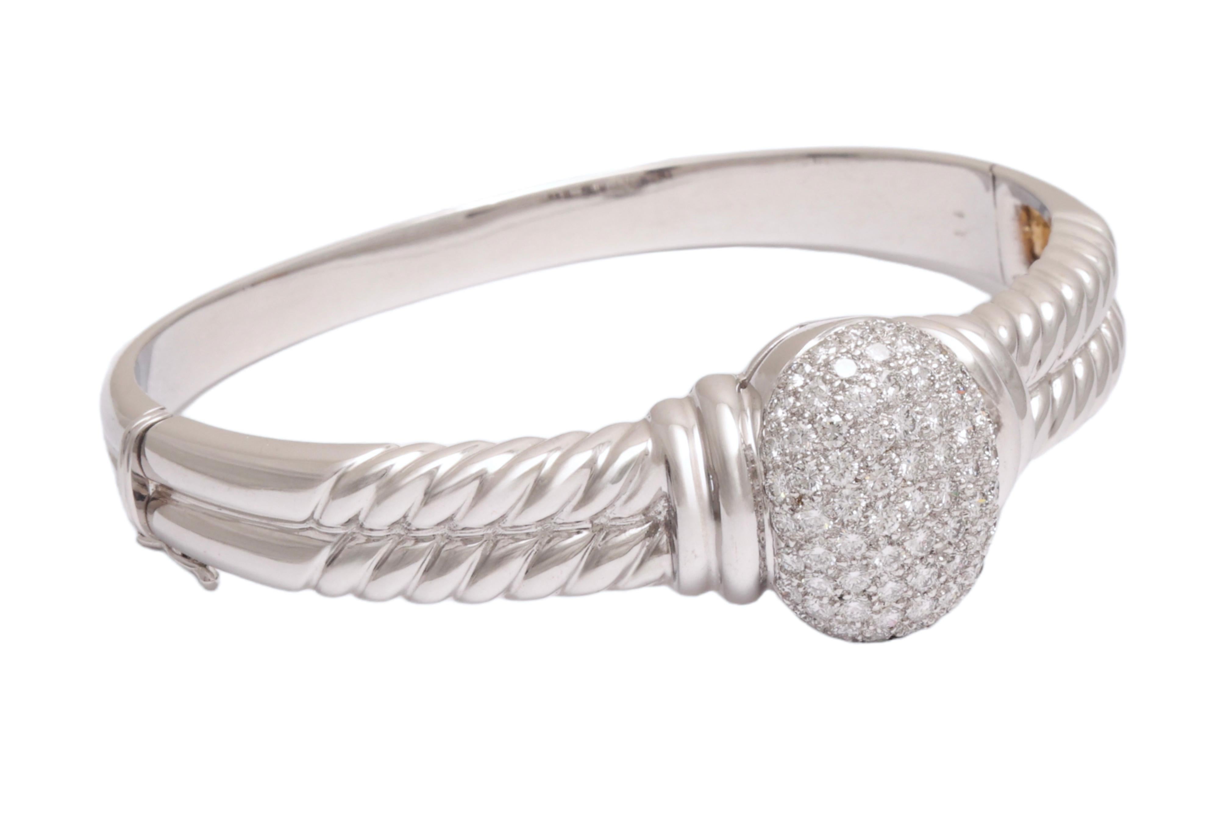 Stunning 18kt White Gold Bangle Bracelet With diamonds. 

Possibility to purchase a matching ring to the bracelet

Diamond: 80 brilliant cut diamonds : 3,2 ct

Material: 18kt solid gold

Measurements: length 64.2 x height 61.7 x width 18.9 mm, Will 