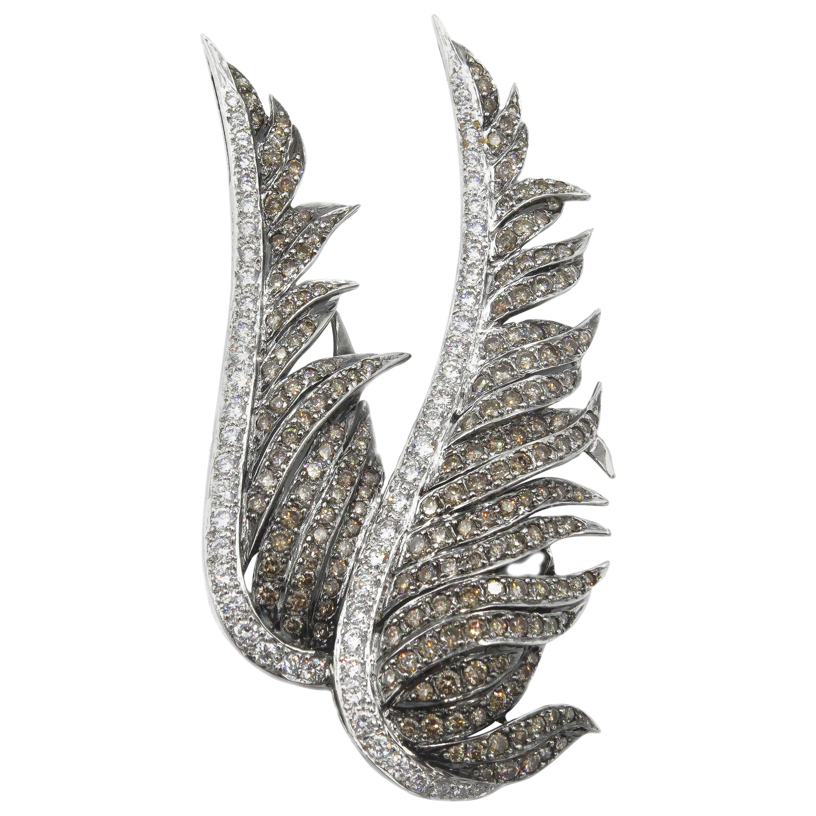 18 Karat White Gold Brooch of Carved Wings with Encrusted Diamonds For Sale