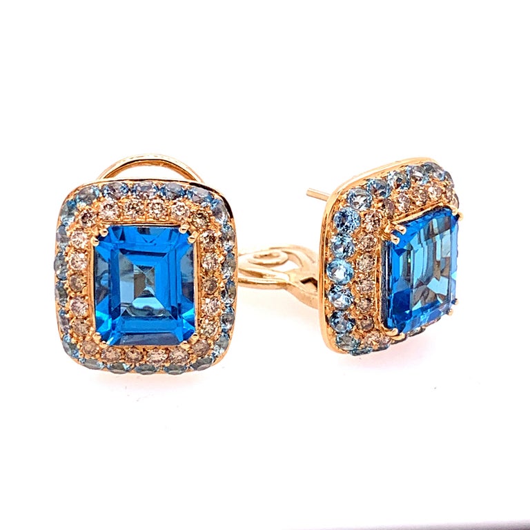 18 Karat White Gold Brown Diamonds  and  Blue Topaz Earrings,  mm19x17
18kt White gold   gr: 14.10
Brown Diamonds ct 1.16
Blue Topaz ct 13.26
Matching ring also available upon request.
 
