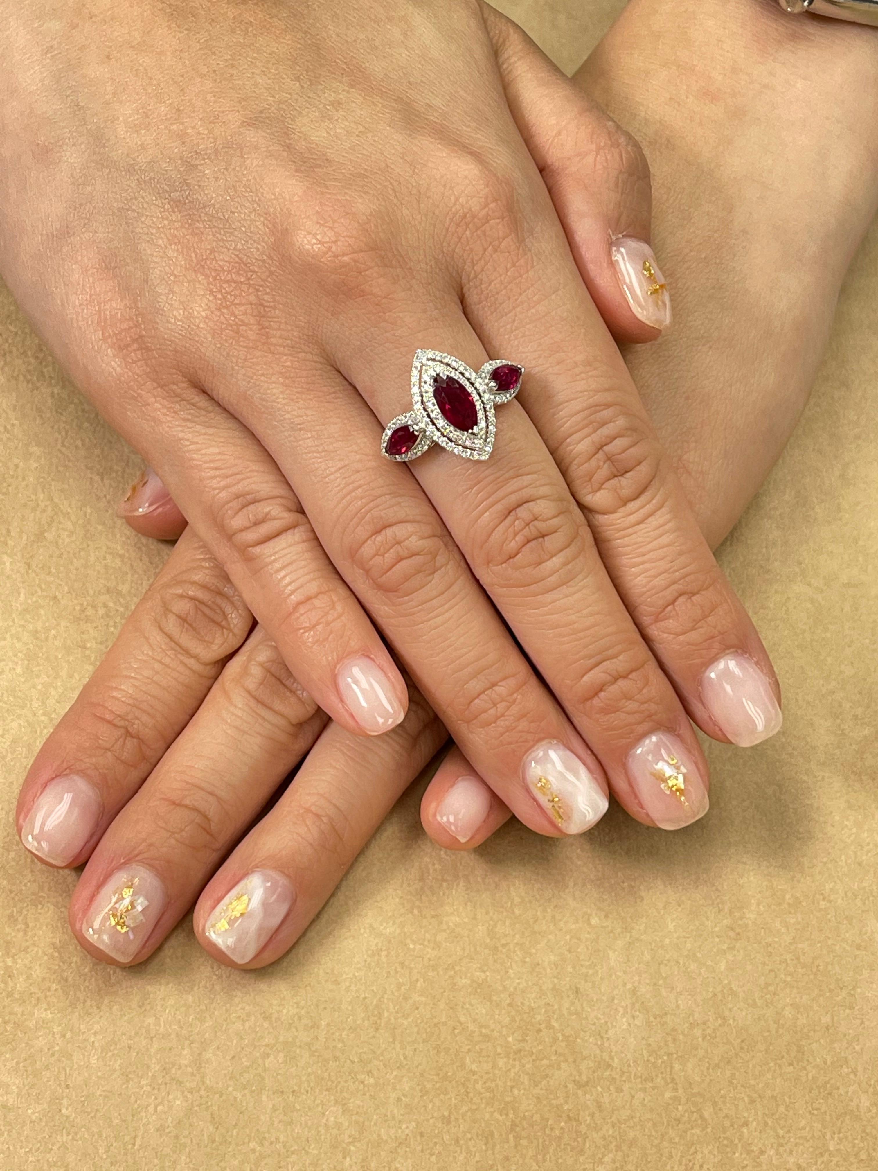 I can personally guarantee that this ring looks nicer in person than any photos or videos! New old stock. Very difficult to capture the color but this is a very nice piece! Here is a nice vivid red Ruby and diamond ring. The ring is set in 18k white