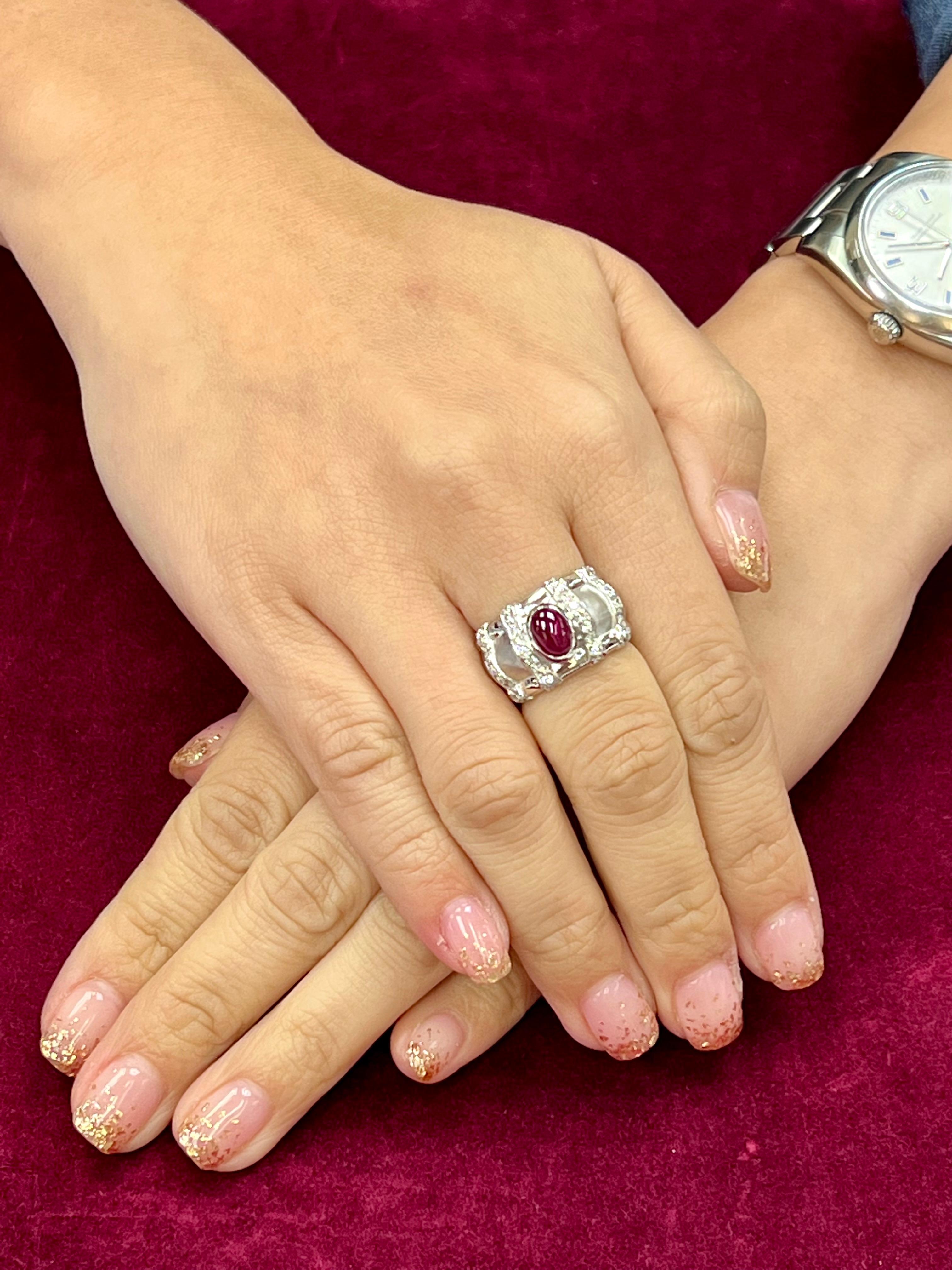 Please check out the HD video! This is a nice piece! Here is a nice Burma Ruby and diamond ring. The ring is set in 18k white gold with white diamonds. The center Burma ruby cabochon is 1.93cts. There are also 34 small white diamonds totaling