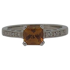 18 Karat White Gold Burnt Orange Sapphire Solitaire Ring with Diamond Shoulders