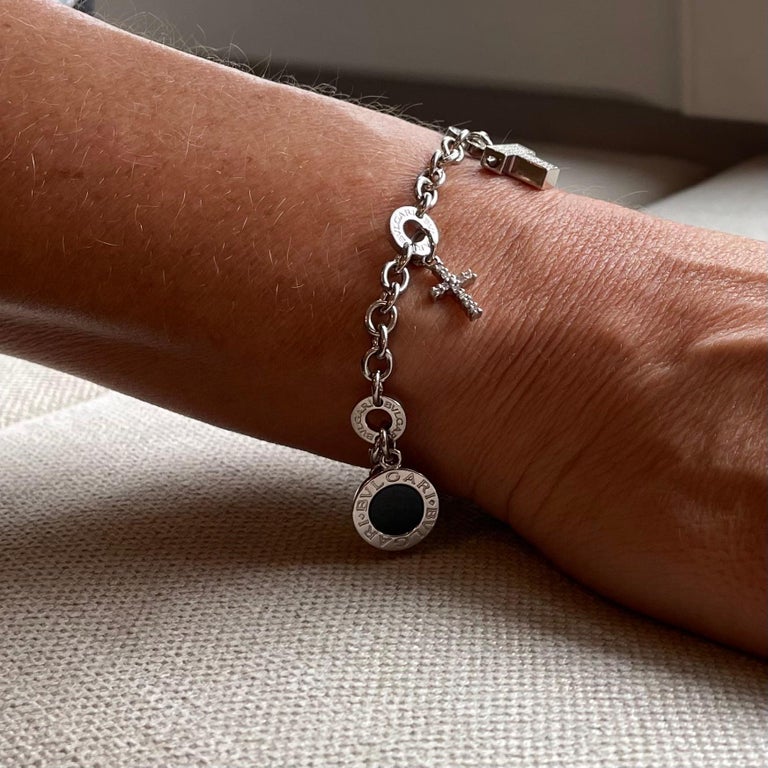 18 Karat White Gold Bvlgari Onyx and Diamond Charm Bracelet For Sale at