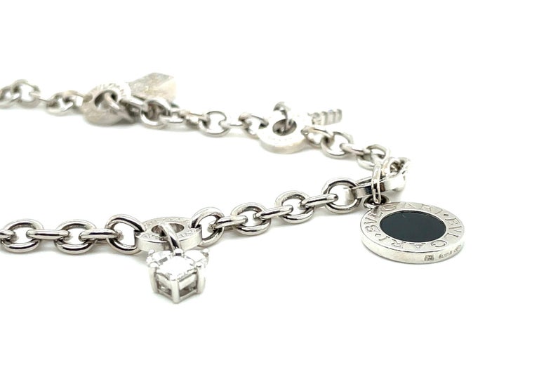 18 Karat White Gold Bvlgari Onyx and Diamond Charm Bracelet For Sale at